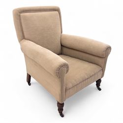 Late 19th century Howard style upholstered armchair, with deep seat and scroll arms, on tu...