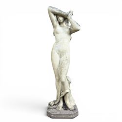 Composite stone garden figure of a scantily clad lady
