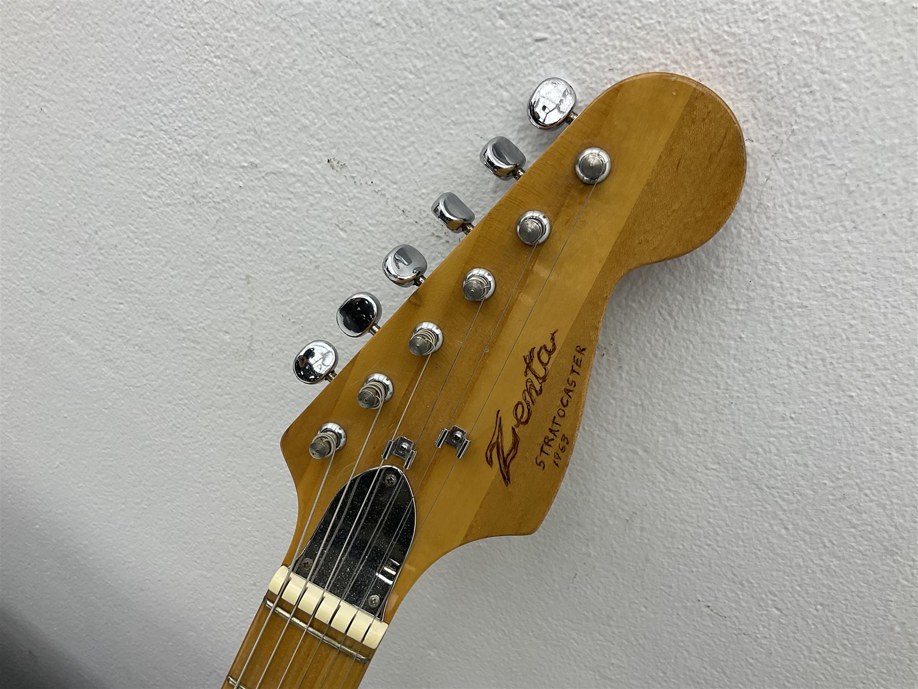 Fender style sunburst electric guitar with manuscript mark 'Zenta Stratocaster 1963' L97cm; in hard carrying case; another similar unmarked sunburst electric guitar; in gig bag; and Fender Frontman Amplifier, serial no.M473406 (3)