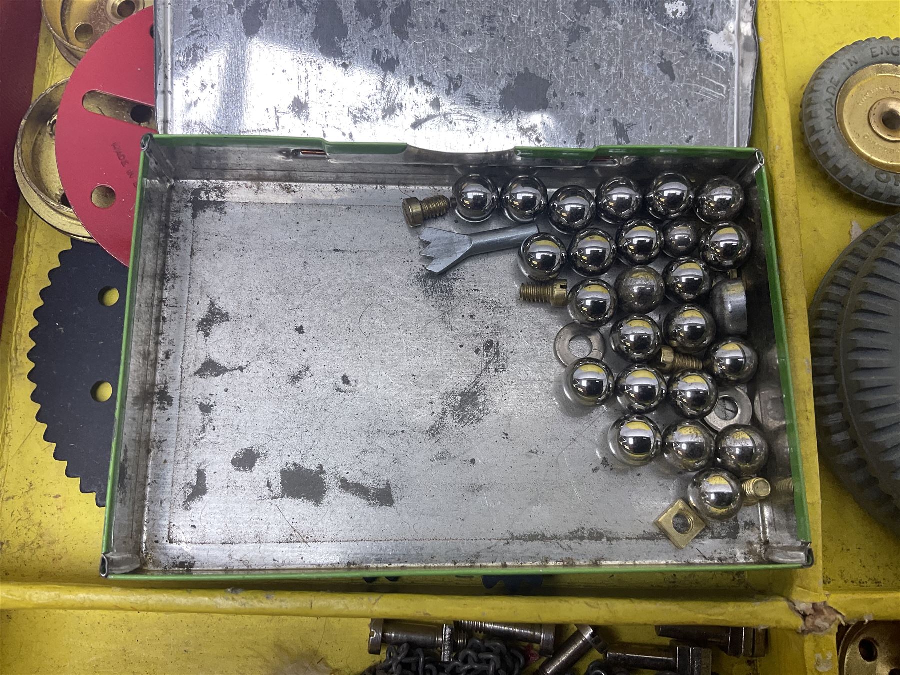 Meccano Outfit No.9 - with good quantity of red and green plates, strips, wheels, brackets, trunnions, tyres, cylinders etc; original box with lift-out tray and instruction manual