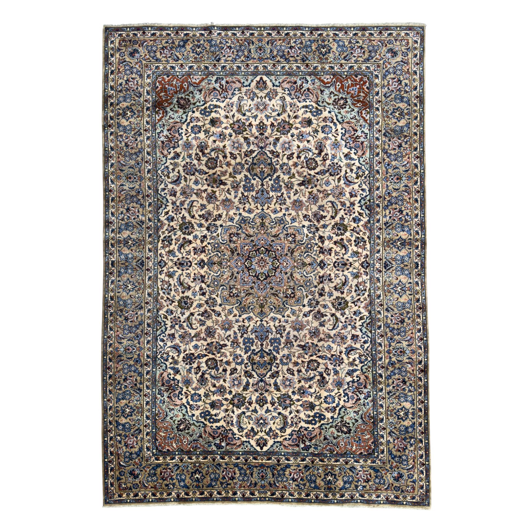 Central Persian Najafabad hand-knotted carpet, the ivory field with a central floral medallion radiating palmettes and arabesques in tones of blue, lilac and tan, enclosed by a wide navy border of scrolling vine and rosette motifs, with red spandrels and multiple guard stripes