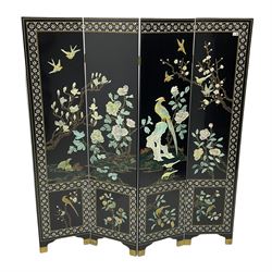 Japanese Shibayama style black lacquered four panel folding screen, naturalist scenes of trailing branch and blossom flowers, decorated with with birds, floral mother of pearl inlaid borders