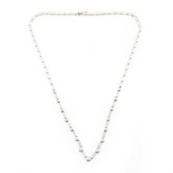 18ct white gold diamond necklace, bezel set with a single round brilliant cut diamond, spaced by two further diamonds, to a rectangular link necklace, London 2000, total diamond weight approx 0.75 carat