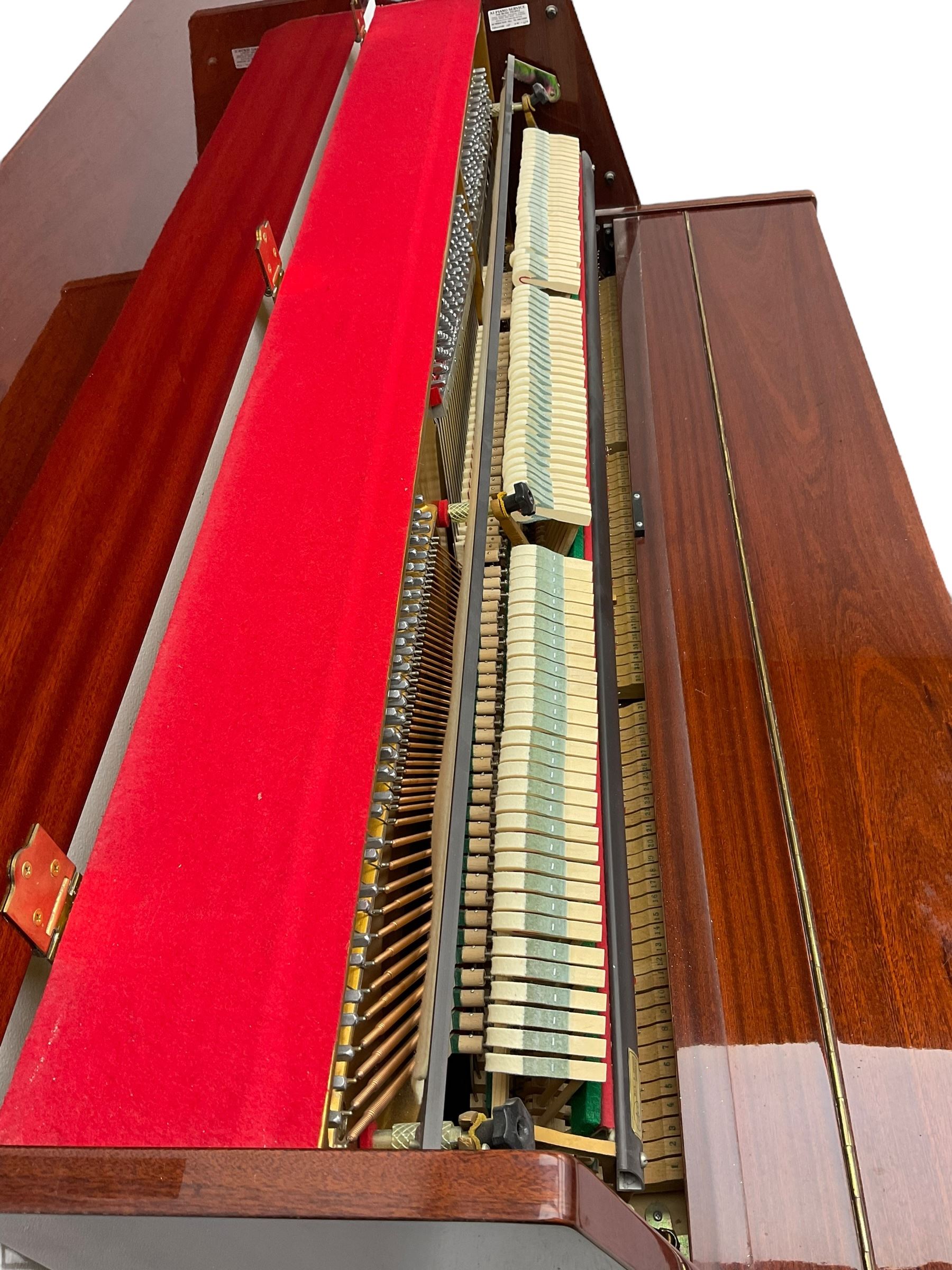 Steinmayer upright series 108 piano in sapele mahogany case, with an overstrung Iron frame and underdamper action, sustain, sostenuto and practise pedal, full compass seven octave 88 note keyboard serial Number 97050003 