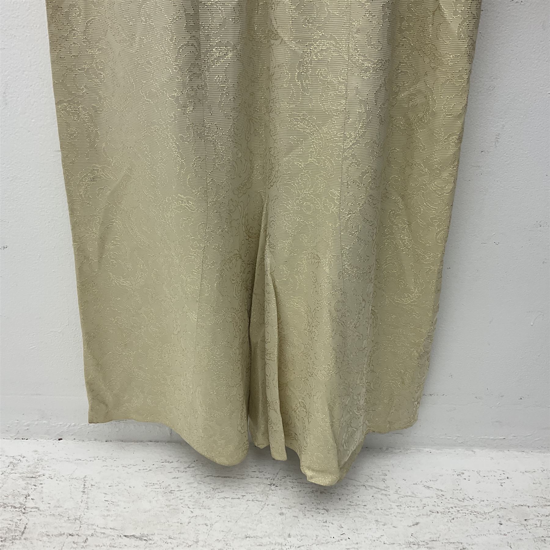 WW2 British female ATS Sergeant's service uniform grouping, consisting of four pocket female pattern service dress tunic with brass ATS shoulder titles and general service buttons; cloth lined interior with the original printed size label dated 1942; the matching khaki service dress skirt; and Greatcoat with size label dated 1945; together with army knitted sleeveless V-neck jumper; WRAC tunic, skirt and overcoat; full length cream and gold thread military evening dress by Hilliers Couture; and four webbing belts