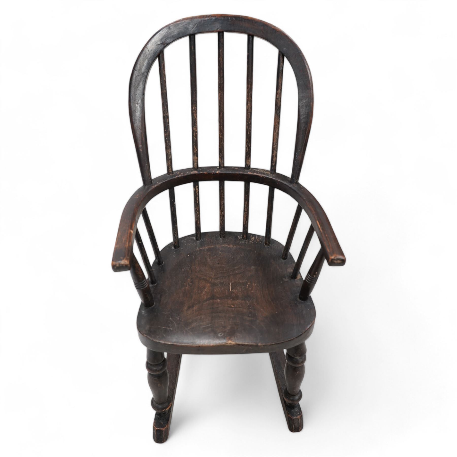 19th century child's Windsor rocking chair, double hoop and stick back, dish seat on turned supports united by rockers 