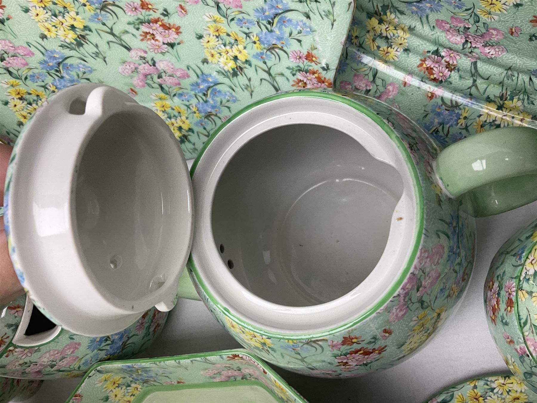 Shelley Melody pattern tea service for six, to include teapot, teapot stand, hot water jug, milk jug, covered sucrier, teacups and saucers, cake plates etc (31)