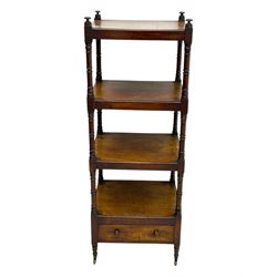 Early 19th century mahogany whatnot, with four rectangular shelves, the lower shelf fitted with a single drawer, supported by slender turned columns, raised on turned supports with brass castors