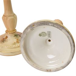 Royal Worcester blush ivory dressing table set, decorated with flowers, comprising an oval tray, three covered pots and a pair of candlesticks 