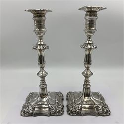 Pair of late Victorian silver mounted candlesticks, each of knopped and part fluted form, upon square stepped base with anthemions to each corner, with conforming sconces, hallmarked to removable sconces and foot, Thomas A Scott, Sheffield 1901, H25.2cm