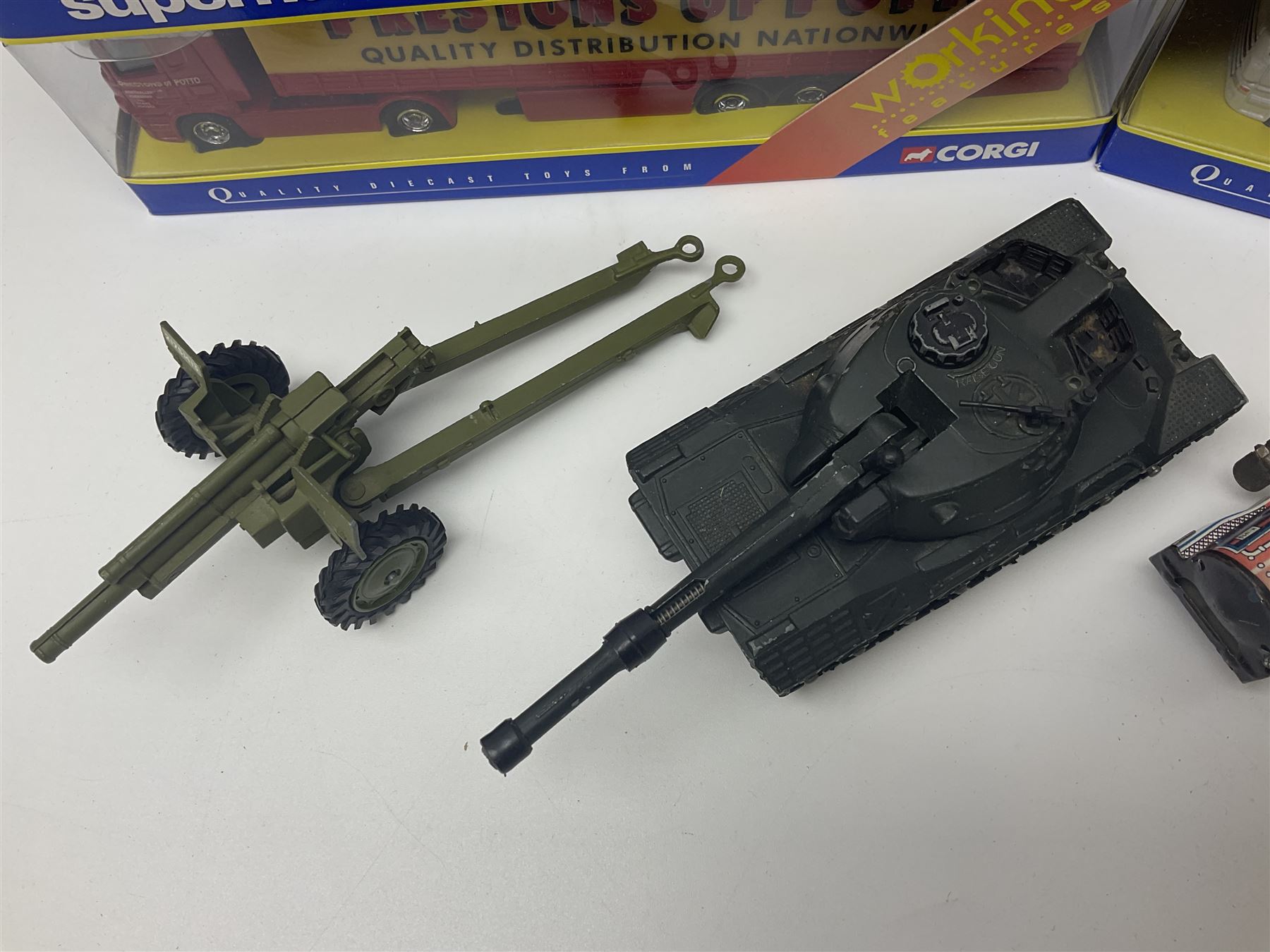 Crescent Saladin Armoured Patrol Set; boxed; unboxed Dinky Leopard Tank and American 105mm gun; two Corgi Superhaulers - TY86601 Scania Race Transporter Castrol Honda and TY86617 Scania Cutrainside Prestons of Potto; both boxed; and post-WW2 German clockwork tin-plate three-piece train set