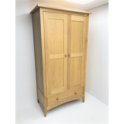 Solid ash double wardrobe, two drawers enclosing hanging rail and shelf above single drawer, tapering stile supports, W108cm, H203cm, D58cm