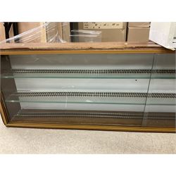 Six shelved cabinets for displaying ‘00’ gauge locomotives comprising plain plywood and white painted examples with track applied to various shelves, largest H63cm, W107cm, D27cm; Collection of tools for building model locomotives to include Weller PU-2D Soldering Pencil and Standard Tip Soldering Iron 20W/230V, Humbrol Modellers Airbrush, Power Supply Units and two wooden chests one of which housing a collection of tools including tweezers, scalping tools, wrenches etc 