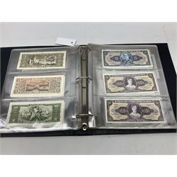 World banknotes, including Queen Elizabeth II The States of Jersey one pound 'DB202703', five pounds 'BB527762' and ten pounds 'AB651481', reserve bank of New Zealand two dollars '1L3 741894', King George V Straits Settlements one dollar 1st January 1935 'F/83 28924', various Bank of England notes etc, housed in two ring binder albums