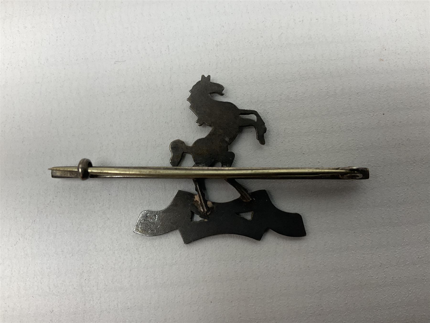 Royal West Kent regiment 9ct gold and enamel sweetheart brooch; The Queens Own regiment silver and enamel sweetheart brooch; and another sweetheart brooch for the Royal West Kent regiment (3)