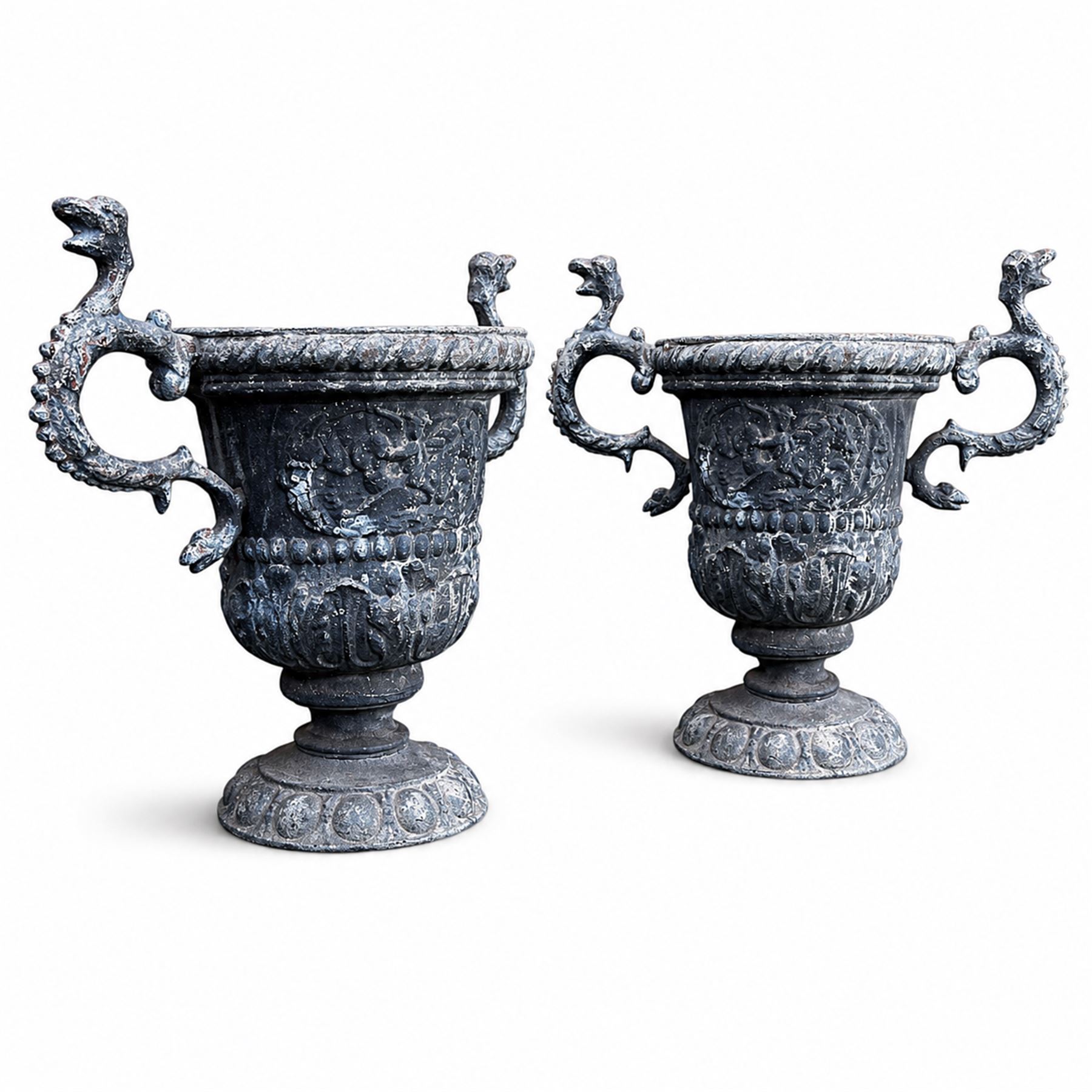 Impressive pair of early highly decorative lead garden urns, griffin handles with ornate decoration depicting cherubs and laurel wreath
