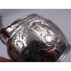 George III silver cream jug, of helmet form with angular handle, embossed with floral and scrolling decoration and engraved initial, hallmarked Edward Mayfield, London 1806, H9.3cm, together with a modern silver 'Sherry' decanter label, hallmarked Birmingham Mint, Birmingham 1986