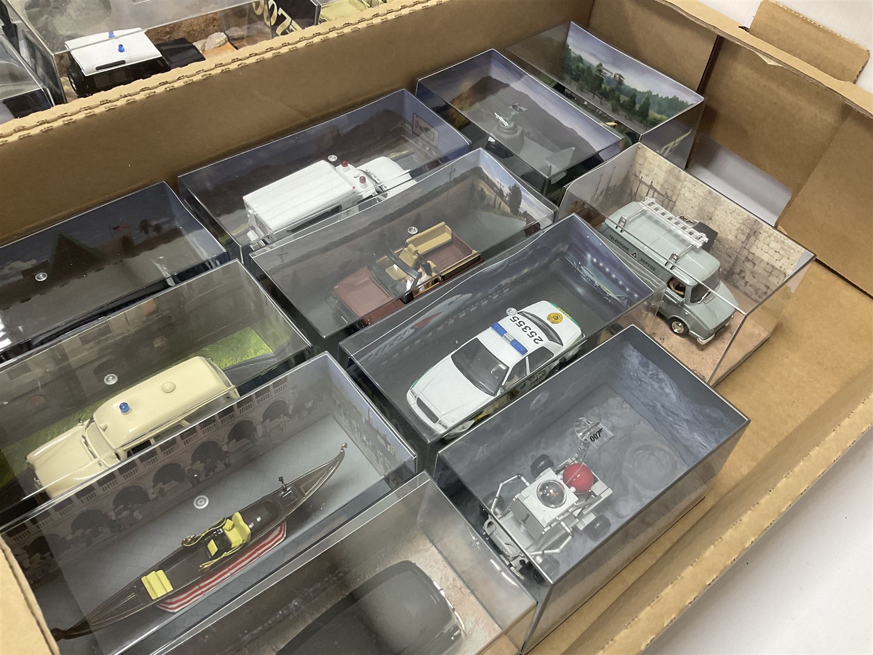 Fabbri James Bond Collection - over one hundred and ten die-cast models in perspex display cases as issued periodically; and a quantity of associated magazines and trading cards, in five boxes