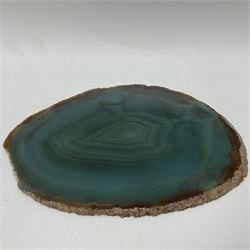 Pair of green agate slices, polished with rough edges raised upon silvered metal stands, H19cm