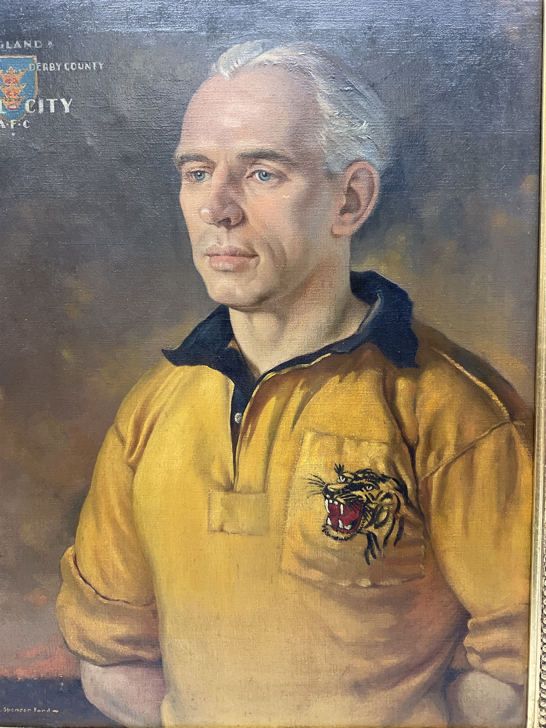 Roland F. Spencer Ford (1902 - 1990), oil painting on canvas, half length portrait of Raich Carter, standing dressed in Hull City kit, the Hull town crest in the background surrounded by the names Hull City A.F.C., Sunderland, Derby County and England, bears label verso from the studio of the artist in Newstead Street, Hull with original price of £75, signed, 59.5 x 49.5cm, gilt frame with metal plaque inscribed ' Presented by the Management Committee/of the Hull City Supporters Clubs/as a mark of esteem and appreciation/for services rendered to/Hull City A.F.C./and to football in general/October 1952'. Provenance: By direct descent from the family of Raich Carter having been consigned by his daughter Jane Carter.