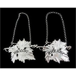 Shop stock: Pair of silver Brandy and Sherry decanter labels in the form of vine leaves by L R Watson Birmingham 2003- 2006, 8.5cm both cased
