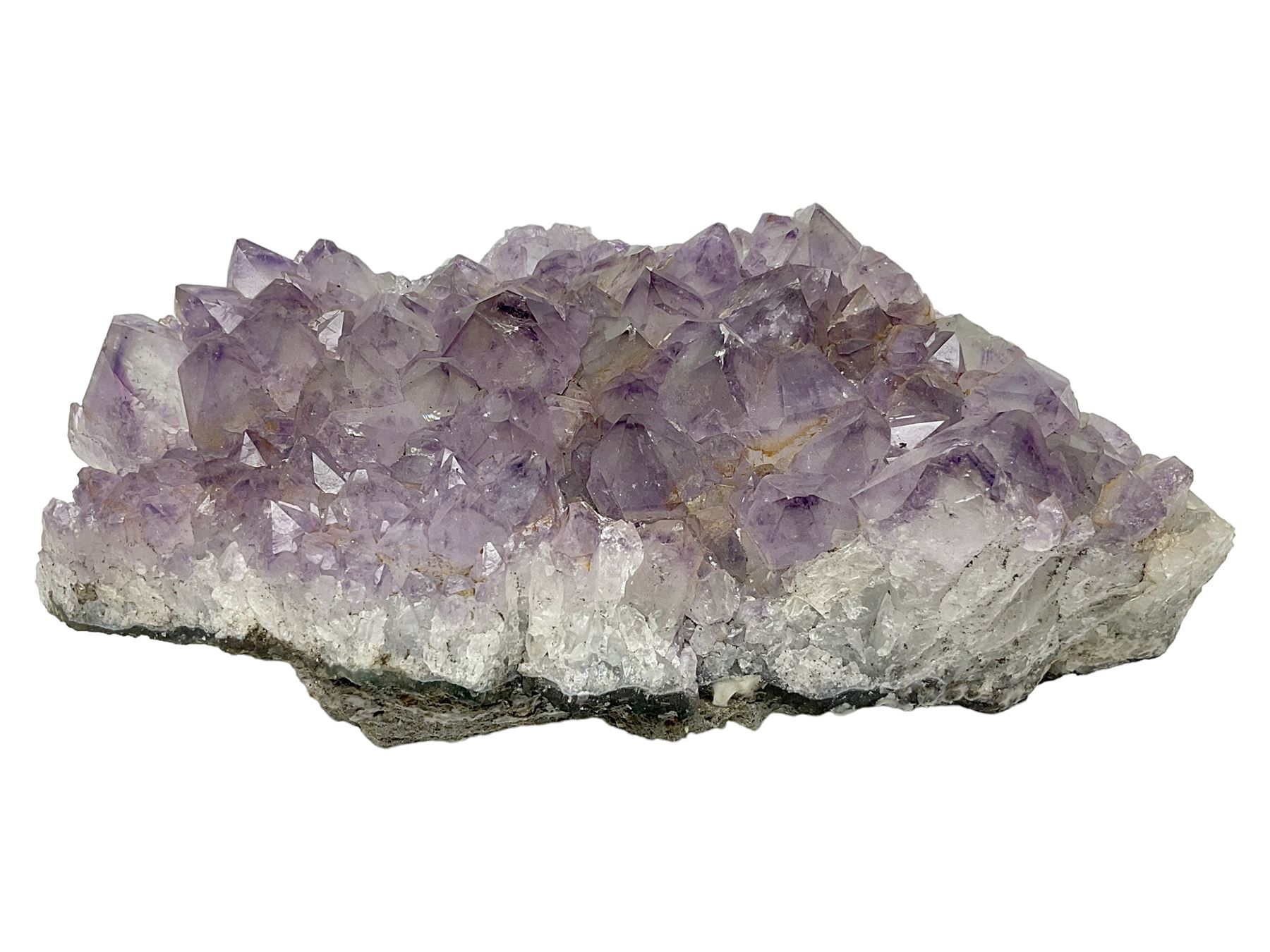 Amethyst crystal geode cluster, with well-defined crystals of various sizes, H10cm, L30cm
