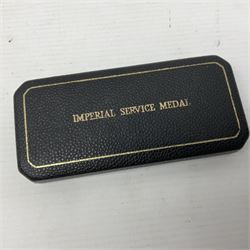 Two Imperial Service Medals to Elsie Hannah Ferguson and Fred Whitehead; each in original case; WWI Special Constabulary Medal to Inspr. Alfred W. Thompson; modern Prisoner of War Medal; cased; replica Victoria Cross and India Mutiny Medals with archive of information relating to Pte. Robert Newell V.C. 9th Lancers; replica Victoria Cross and George Cross with miniatures; and other replica medals etc