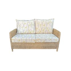 Three piece conservatory suite - cane two seat sofa and pair matching armchairs upholstered in Laura Ashley fabric