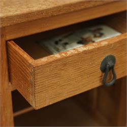 Beaverman - pair of oak bedside cabinets, each with plain rectangular top over single drawer and cupboard below with fielded panels and wrought iron hardware, with signature carved beaver, by the workshop of Colin Almack, Thirsk