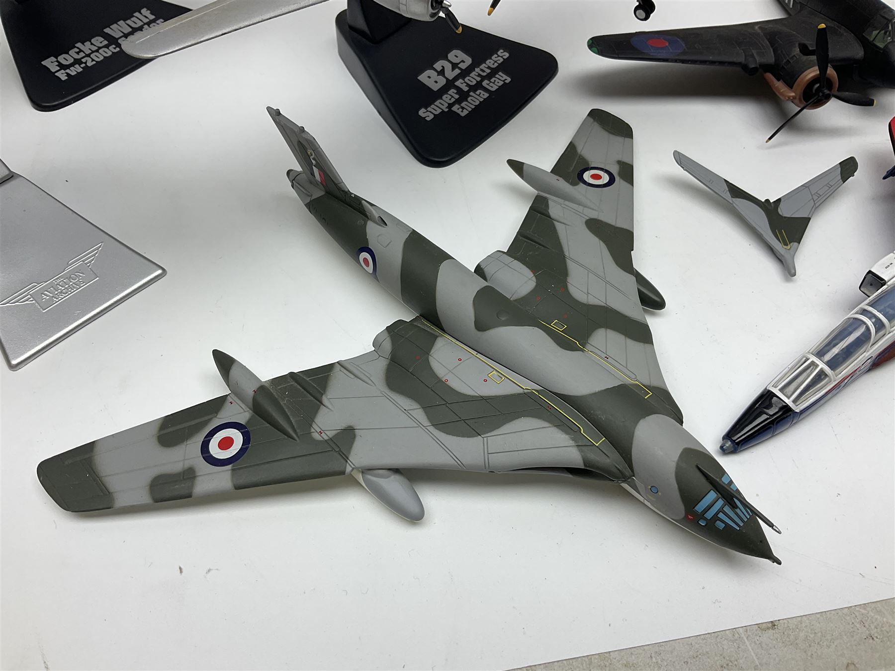 Thirteen unboxed Corgi Aviation Archive or similar die-cast models of aircraft, most with stands; Airfix 1:72 scale construction kit for BAe Harrier GR3; and two boxed Shell Collection die-cast models of cars