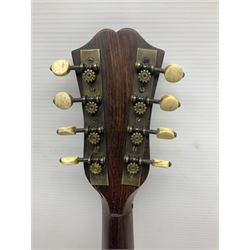 Late 19th century Italian lute back mandolin with segmented bowl back, bears label Gennaro Maglioni Napoli L61cm; in ebonised wooden case; together with another similar damaged Italian lute back mandolin for restoration or spares (2)