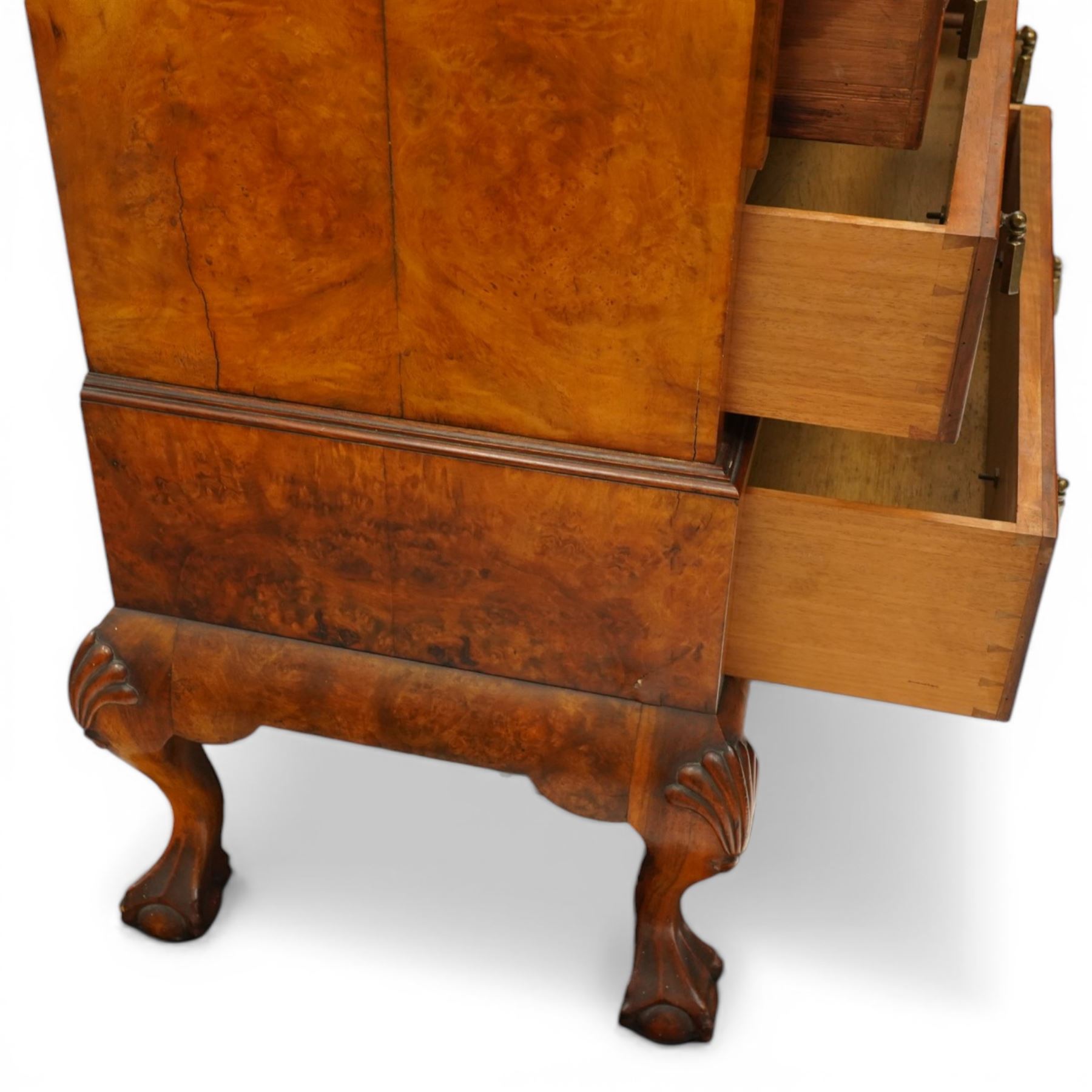 Early 20th century Queen Anne design figured walnut bureau, fall-front enclosing fitted interior, over three graduating cock-beaded drawers, shaped apron with moulded scallop shell motifs, over cabriole supports with ball-and-claw feet