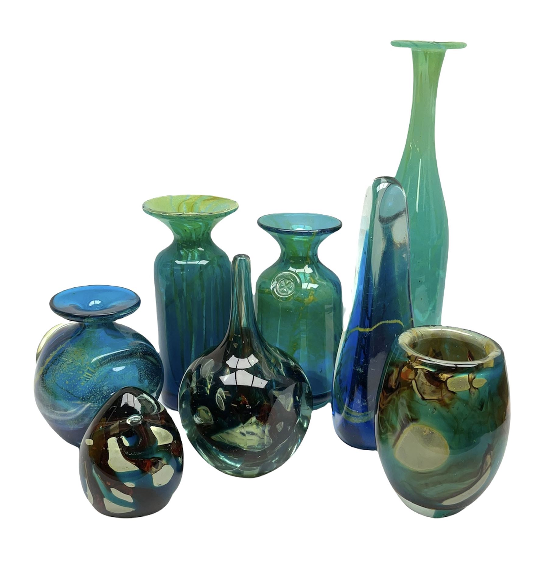 Quantity of M’dina art glass to include a streaked blue and green bottle form vase with captured bubble design and slender neck, H35cm, along with a paperweight, ovoid form vase and another vase all decorated in a blue, brown and white colour way, other contemporary glass examples etc with etched marks beneath