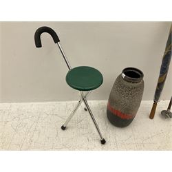 Two smooth polished ram horn handled Shepherd's crooks and a further similar example, together with various shooting sticks, walking sticks and canes, housed in a volcanic lava glaze West German style vase