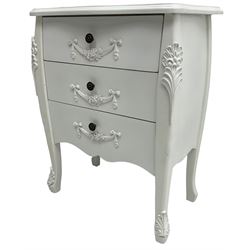 French design white painted chest, shaped top over three drawers, each with applied swags with flower heads, flanked by cabriole uprights with foliate mouldings