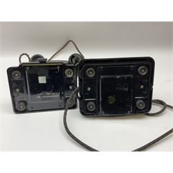 Two black Bakelite telephones of pyramid form with rotary dials, comprising The Telephone Demonstration Set model. 6al with base drawer and light bulb, and another larger with G.P.O FWR 58/2 stamped marks beneath, largest H18cm W20cm D16cm