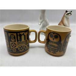 1970's Hornsea mugs, comprising Train Robber pattern designed by John Clappison and Owl from the ‘Newsprint’ Zoo range designed by Jack Dadd, and three USSR figures of animals comprising raccoon, ferret and badger