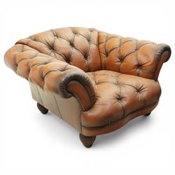 Tetrad England - large armchair upholstered in buttoned leather, with stool