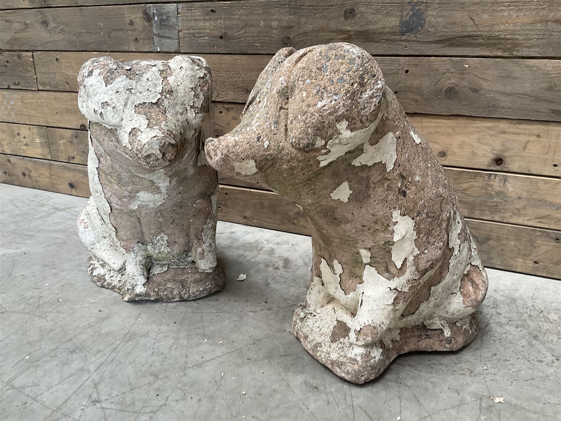 Pair painted stone pigs 