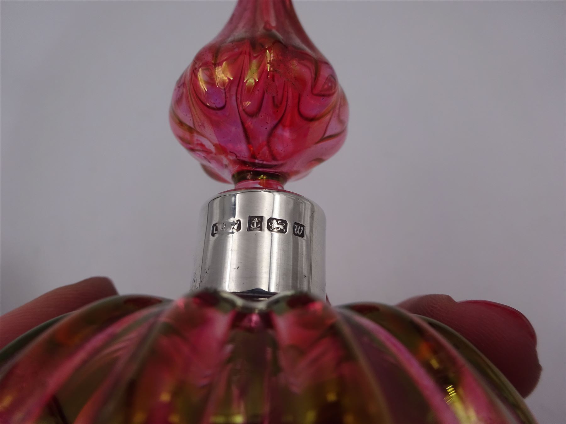 Modern novelty silver tape measure, in the form of a pig, hallmarked CME Jewellery Ltd, together with a silver mounted pink glass scent bottle, signed H. White to base, with silver collar hallmarked Laurence R Watson & Co, Birmingham 1996, scent bottle H12cm