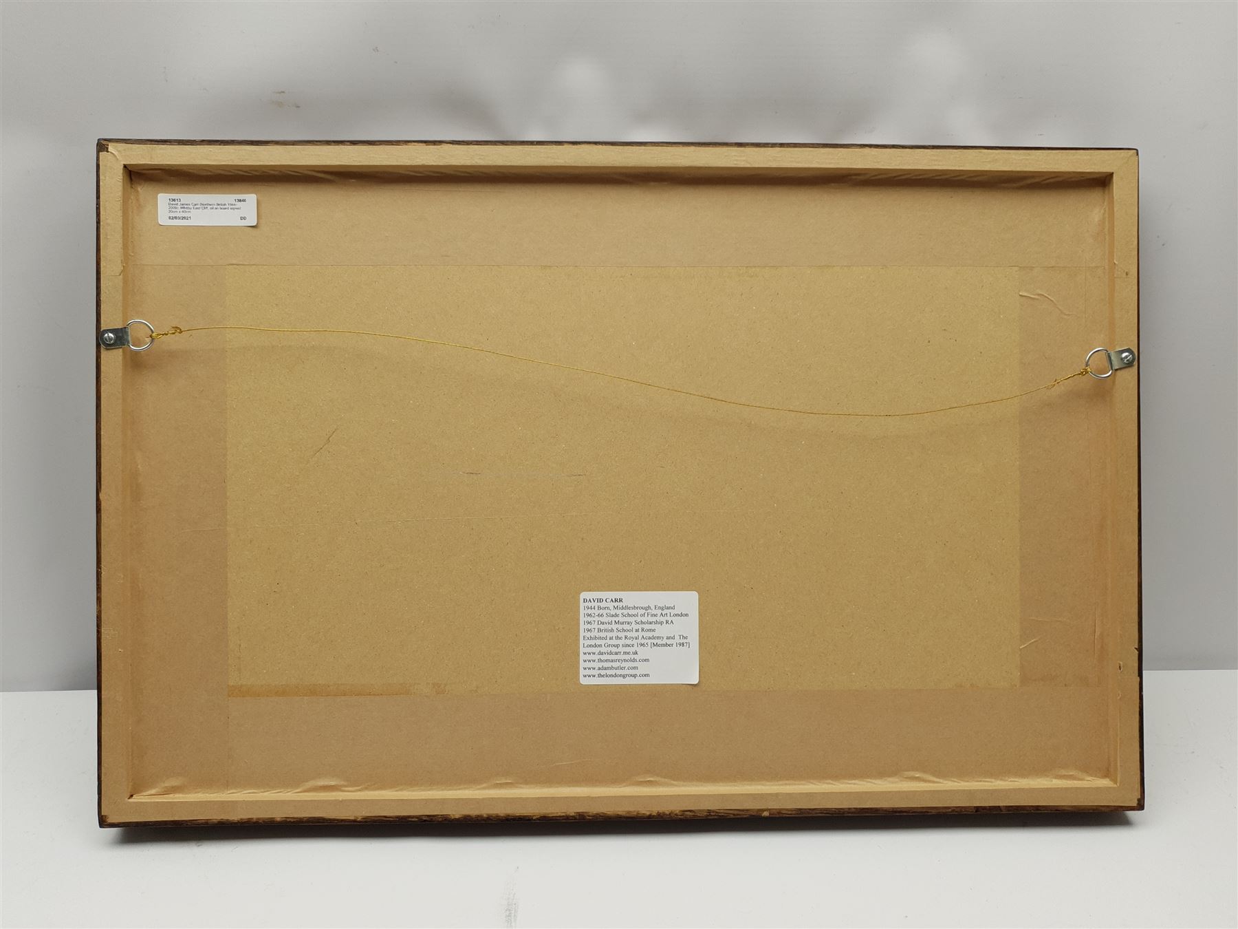 David James Carr (Northern British 1944-2009): Whitby East Cliff, oil on board signed 20cm x 40cm