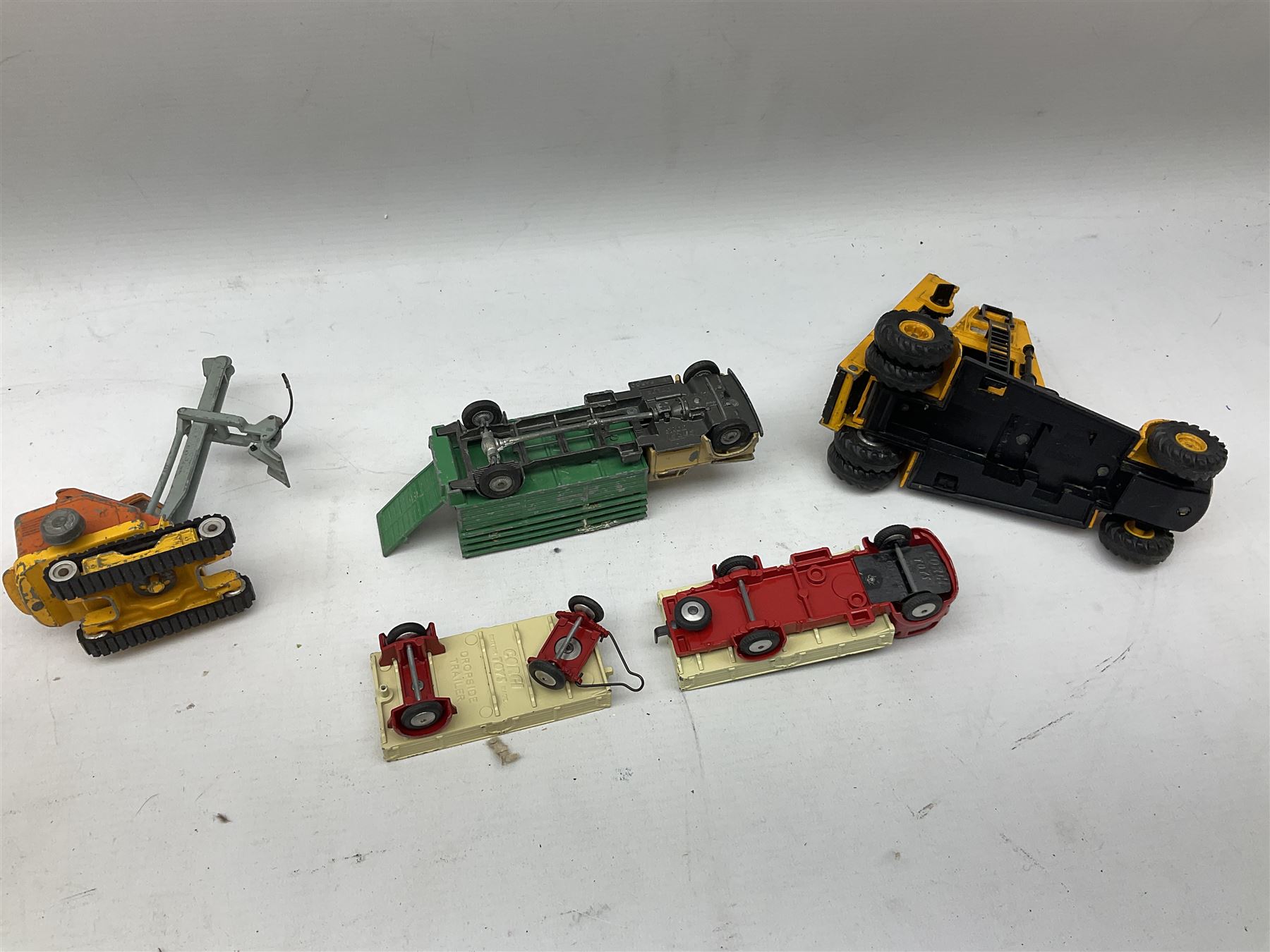 Corgi - eighteen unboxed and playworn/repainted die-cast commercial vehicles including Commer 5-Ton Wagon with drop-side trailer and two other 5-Ton wagons, Dodge Key Fargo, Jeep FC-150, two London Routemaster buses, Carrimore Trideck Transporter, two Carrimore Mark IV Transporters, Carrimore Low Loader, Ecurie Ecosse Racing Car Transporter etc (18)