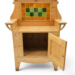 Arts & Crafts pine kitchen cabinet, raised tiled back with projecting shelf and shaped side supports, rectangular work surface above single cupboard door with moulded panel, on square supports