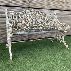 Victorian heavy ornate cast iron and wood slatted garden bench painted in white, decorated...