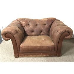 Snuggle armchair upholstered in a deep buttoned chocolate fabric