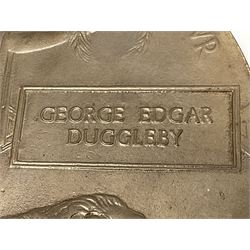 WWI bronze memorial plaque named to George Edgar Duggleby, in card folder