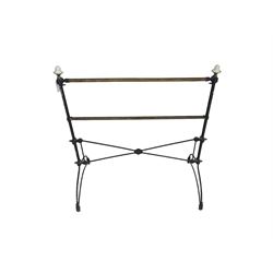 Early 20th century wrought metal and brass towel rail, with ceramic finials