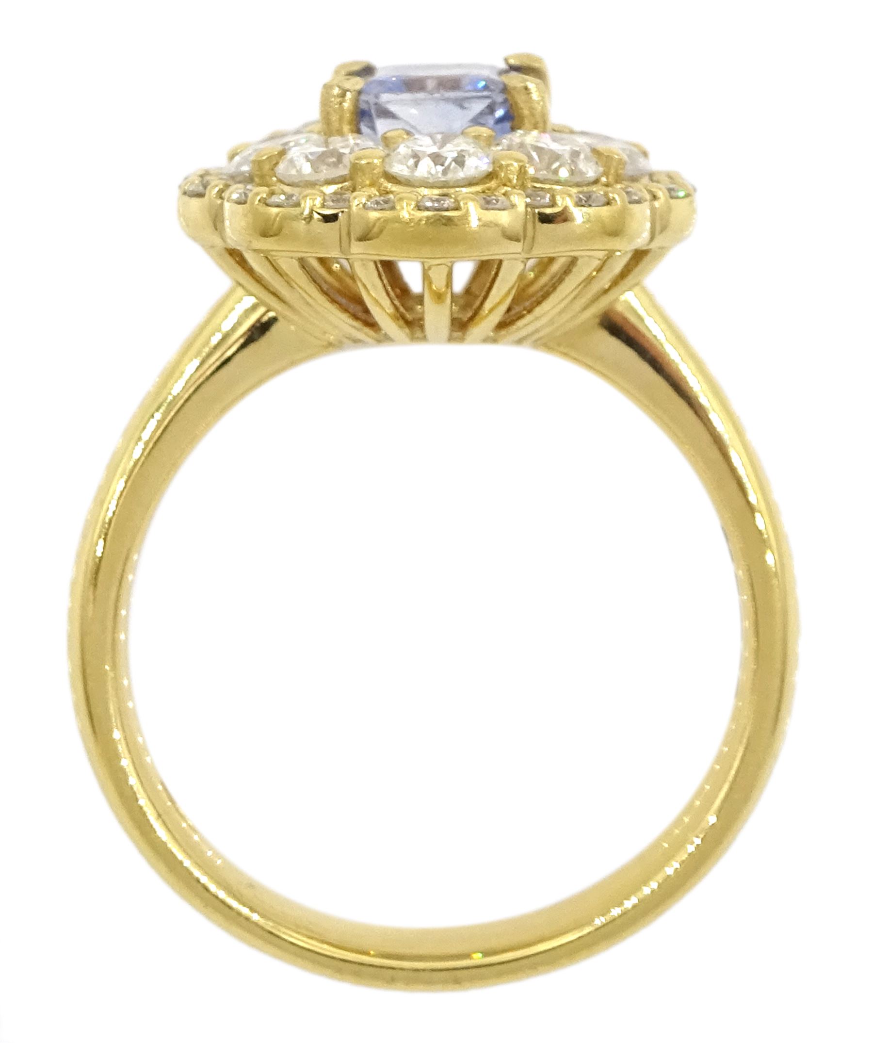 18ct gold radiant cut Ceylon sapphire and round brilliant cut diamond cluster ring, hallmarked, sapphire approx 1.20 carat, total diamond weight approx 1.40 carat