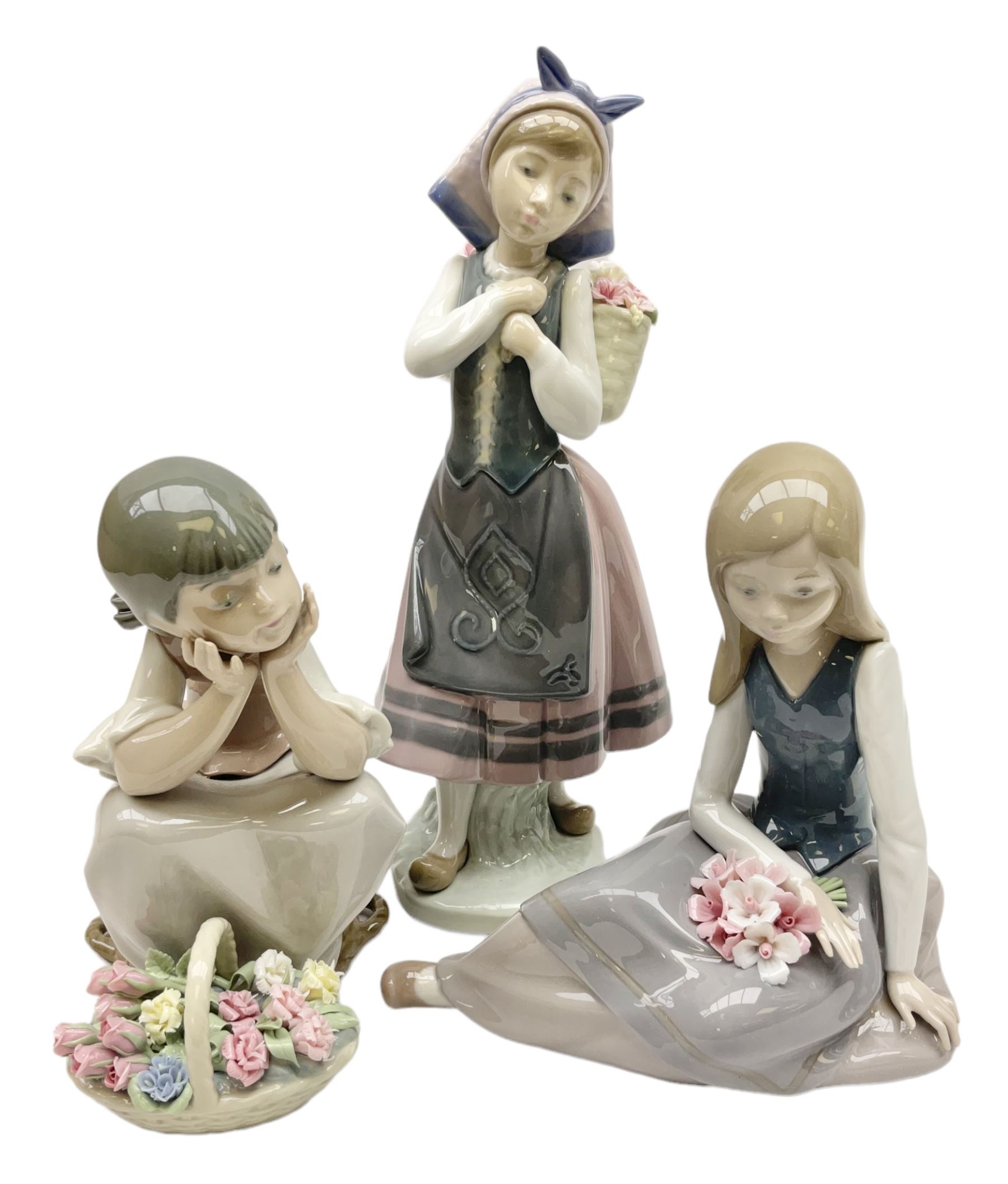 Three Lladro figures, comprising Pondering, no 5173, Nostalgia, no 5071 and Nature's Bounty, no 1417, all with original boxes, largest example H27cm