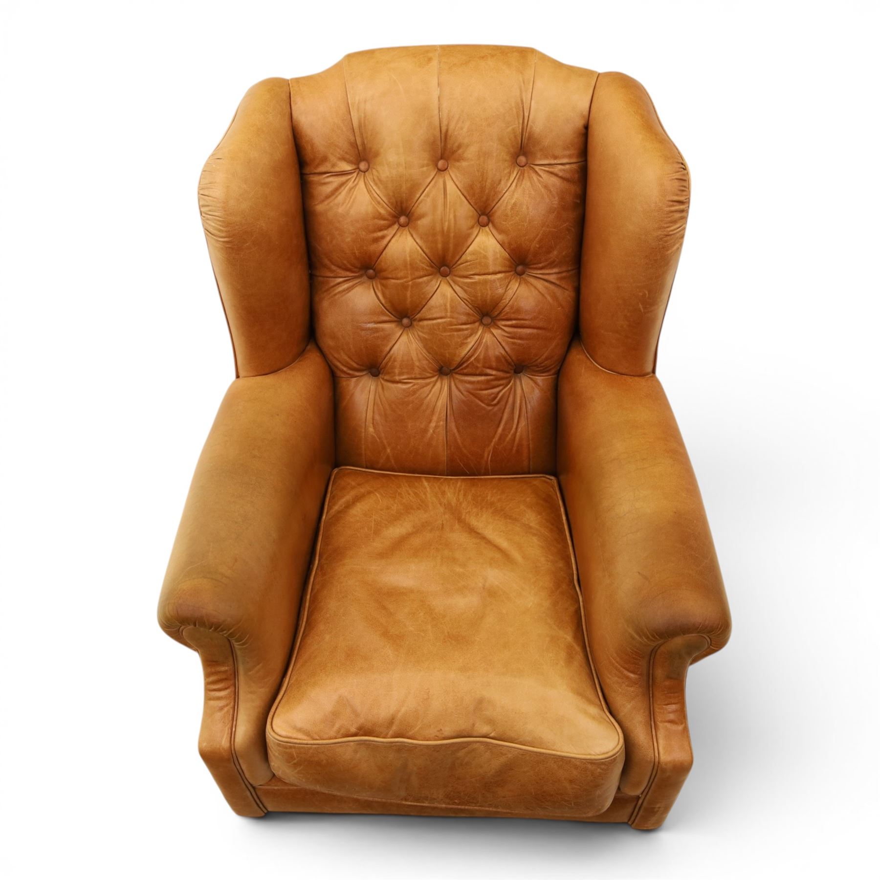 TETRAD for John Lewis - brown leather upholstered wingback armchair, button back with diamond tufted detail, loose seat cushion with piped edge, scroll arms and padded side wings, on short supports